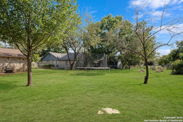 view of yard with a trampoline