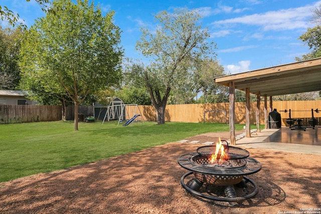 view of yard featuring a patio area and an outdoor fire pit