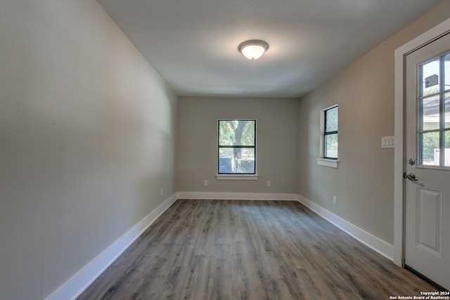 spare room with hardwood / wood-style floors