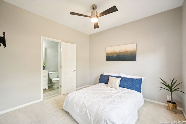 carpeted bedroom featuring ceiling fan and connected bathroom