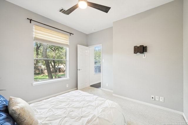 carpeted bedroom with ceiling fan