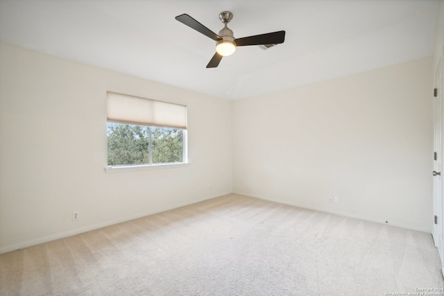 empty room with light carpet and ceiling fan