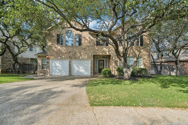 view of front facade featuring a garage and a front yard