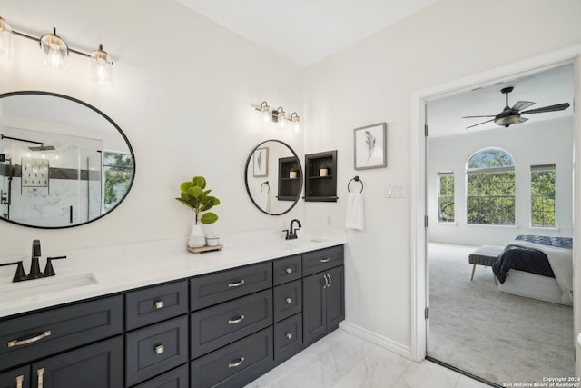 bathroom featuring a shower with door, vanity, and ceiling fan