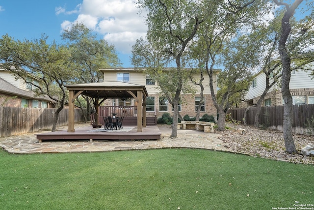 view of yard with a deck and a gazebo