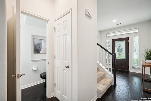 foyer entrance with dark hardwood / wood-style flooring