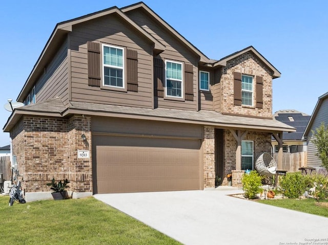 craftsman inspired home featuring driveway, fence, brick siding, an attached garage, and a front yard