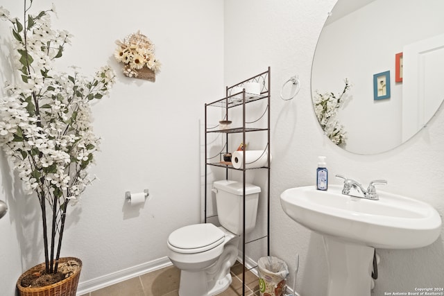 bathroom with tile patterned flooring and toilet