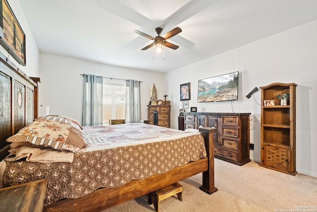 bedroom with a ceiling fan and light colored carpet