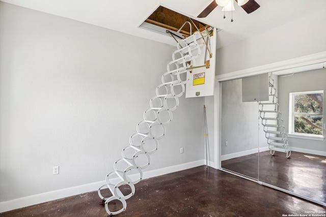 interior space featuring concrete floors and ceiling fan