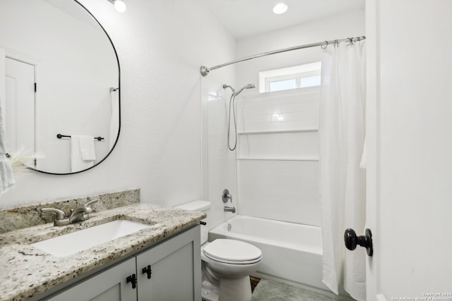 full bathroom with shower / bath combination with curtain, vanity, and toilet