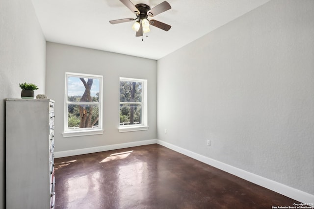 spare room with ceiling fan