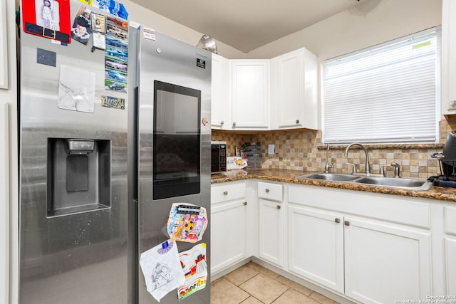 kitchen featuring tasteful backsplash, white cabinets, sink, dark stone counters, and stainless steel fridge with ice dispenser