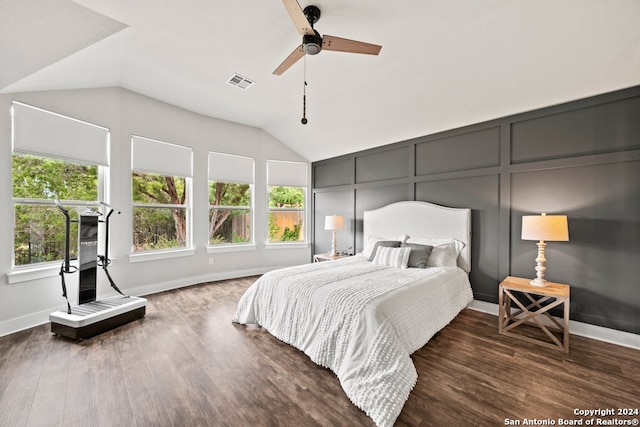 bedroom featuring ceiling fan, lofted ceiling, and dark hardwood / wood-style floors