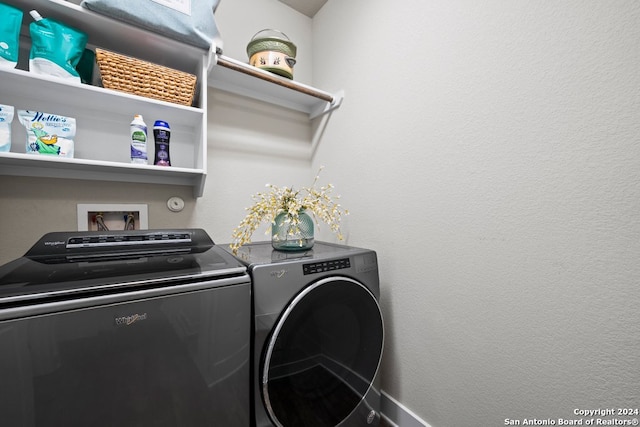 clothes washing area featuring independent washer and dryer