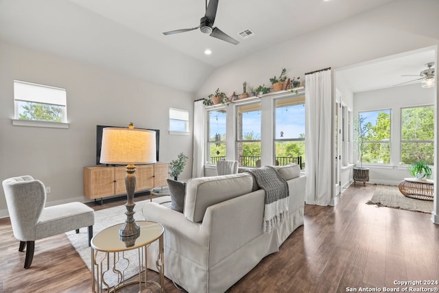 living room featuring hardwood / wood-style floors, vaulted ceiling, and ceiling fan