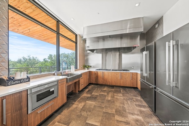 kitchen with stainless steel appliances, sink, and wood ceiling