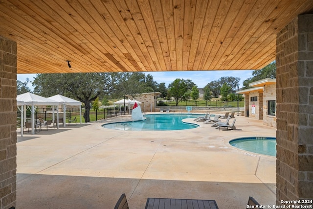 view of pool with a gazebo and a patio