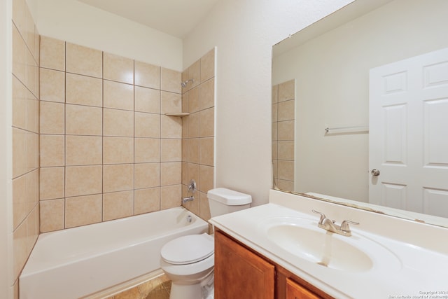 full bathroom with tiled shower / bath combo, vanity, and toilet