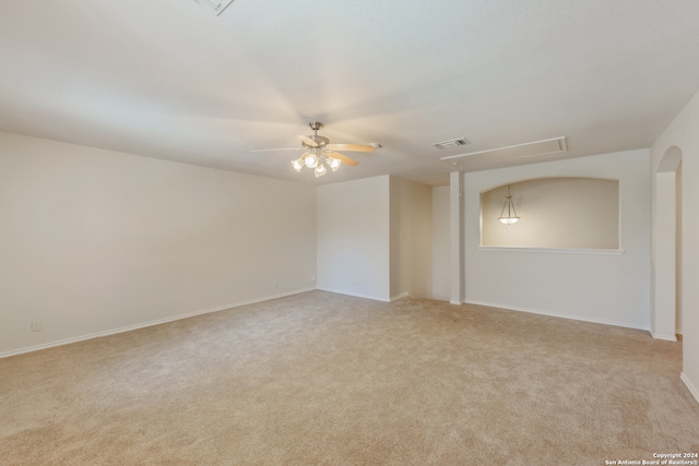 empty room with ceiling fan and light colored carpet