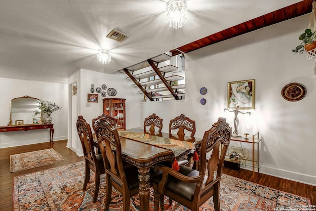 dining space with hardwood / wood-style flooring