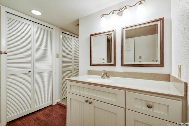 bathroom featuring vanity and hardwood / wood-style floors