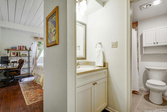 bathroom with vanity, wood ceiling, wood-type flooring, and toilet