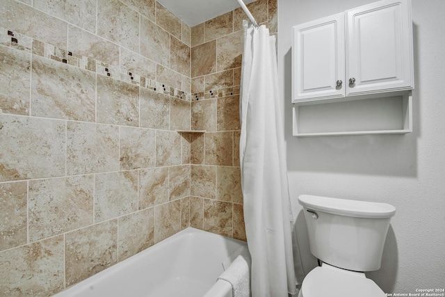 bathroom featuring shower / bath combination with curtain and toilet