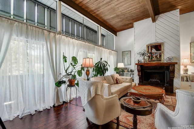 living room with beamed ceiling, dark hardwood / wood-style flooring, a high ceiling, and wooden ceiling