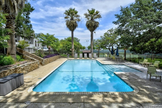 view of pool featuring a patio