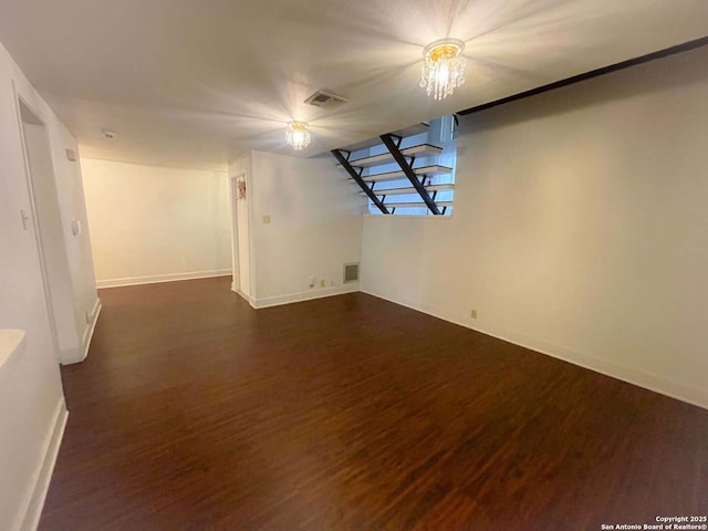 basement featuring dark hardwood / wood-style floors