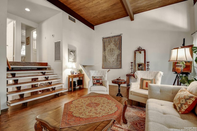 living room with hardwood / wood-style floors, high vaulted ceiling, wooden ceiling, and beamed ceiling