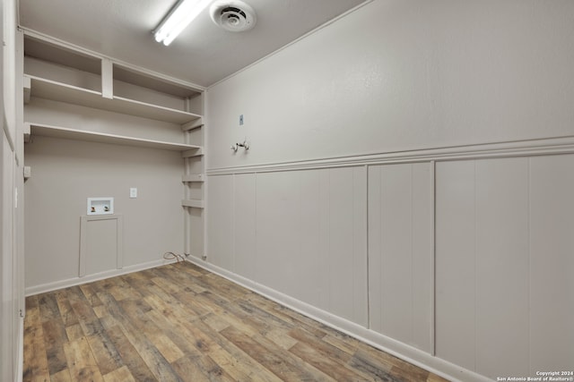 laundry area featuring hookup for a washing machine and hardwood / wood-style floors