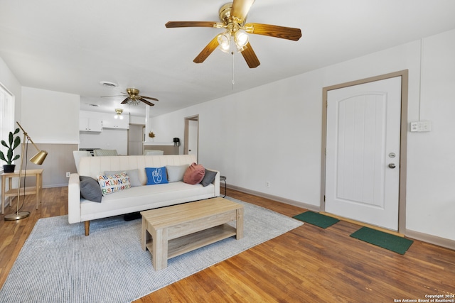 living room with hardwood / wood-style flooring and ceiling fan