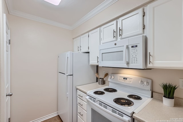 kitchen featuring white appliances, ornamental molding, and white cabinetry