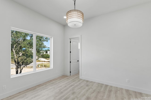 unfurnished room with light wood-type flooring