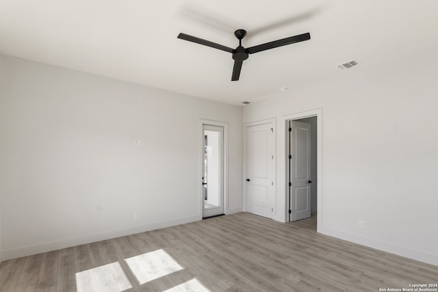 unfurnished room featuring ceiling fan and light wood-type flooring