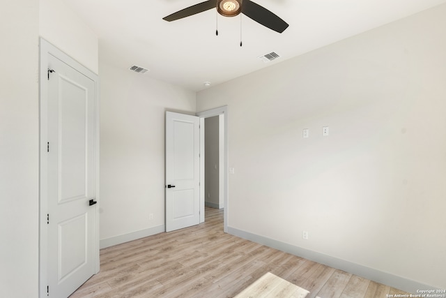 unfurnished bedroom with light wood-type flooring and ceiling fan