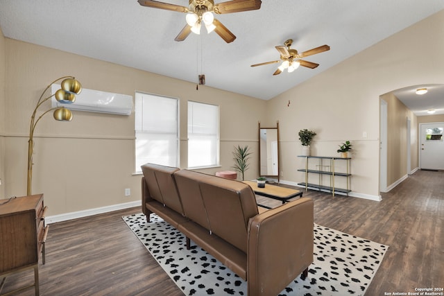 living room with ceiling fan, vaulted ceiling, dark hardwood / wood-style floors, a wall mounted air conditioner, and a textured ceiling