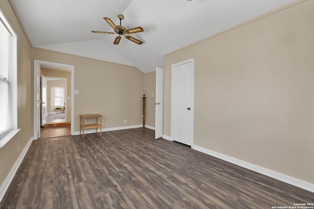 spare room featuring ceiling fan, lofted ceiling, and dark hardwood / wood-style floors