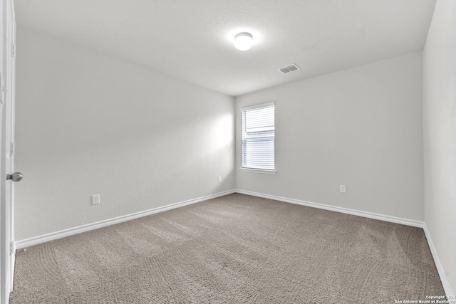 unfurnished room featuring carpet floors