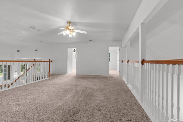 carpeted empty room with ceiling fan