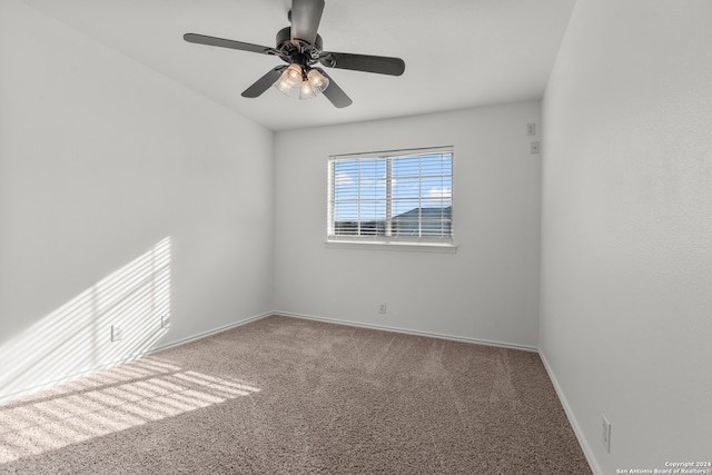 empty room featuring carpet floors and ceiling fan