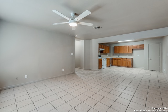 kitchen featuring ceiling fan, light tile patterned flooring, sink, stainless steel dishwasher, and white stove