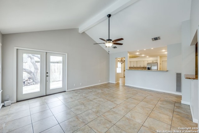 unfurnished living room featuring beam ceiling, ceiling fan, french doors, and light tile patterned floors