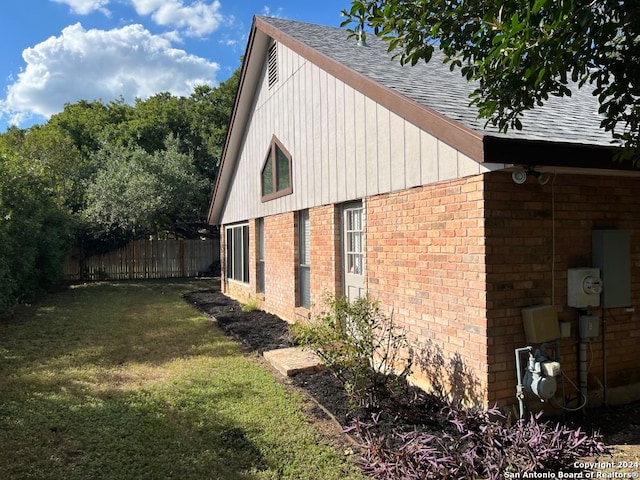 view of home's exterior with a yard