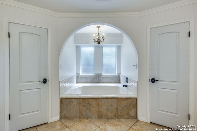 bathroom with a notable chandelier, a relaxing tiled tub, tile patterned floors, and crown molding