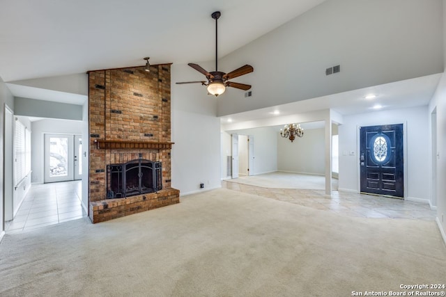 unfurnished living room featuring light colored carpet, a fireplace, and high vaulted ceiling