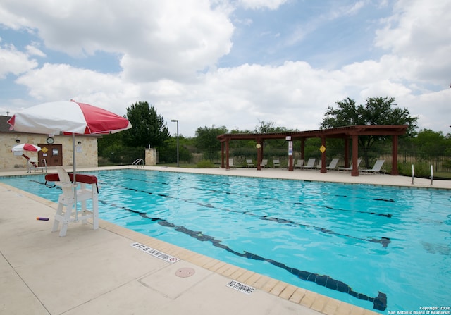 view of swimming pool with a pergola and a patio area