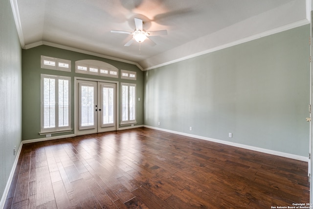 empty room featuring french doors, ceiling fan, vaulted ceiling, and dark hardwood / wood-style floors